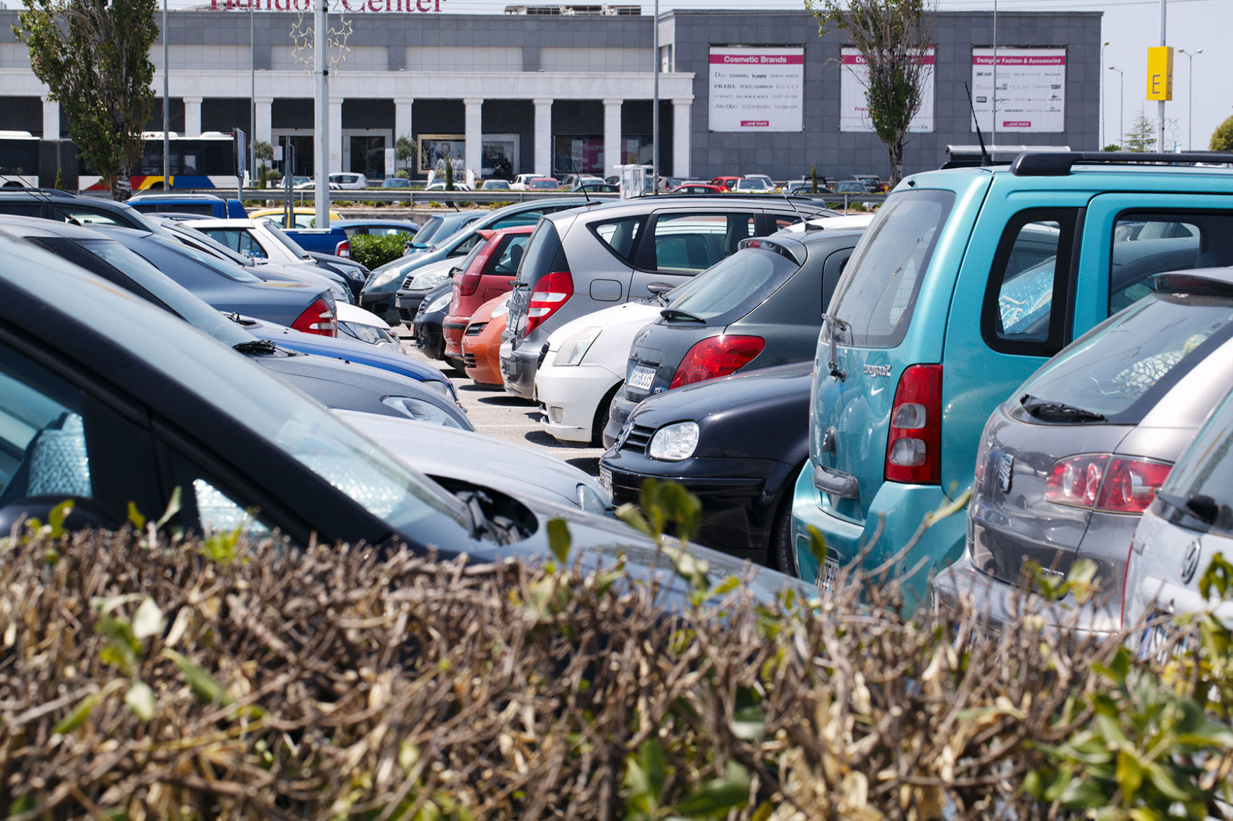 Cars parked in an open-air car park
